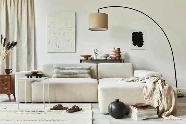 Stylish composition of cozy living room interior design with mock up poster frame and structure painting, corner sofa, coffee table, textile and personal accessories. Scandinavian classic style.