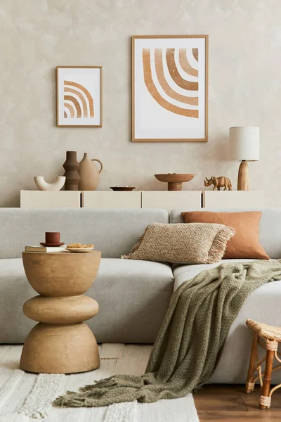 Elegnat living room interior design with mock up poster frame, grey corner sofa, coffee table and personal accessories. Pastel neutral colours. Template.