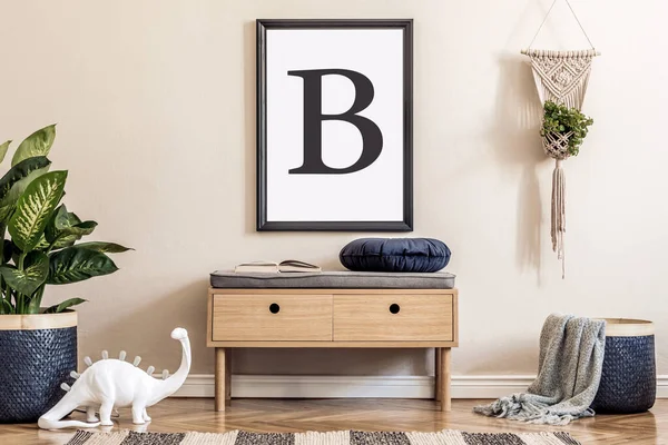 Design scandinavian home interior of living room with wooden commode, design table lamp, macrame, rattan basket with plants and elegant accessories. Stylish home decor. Template. Mock up poster frame.