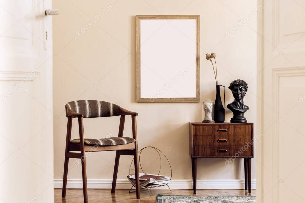 Modern composition of living room interior with brown mock up poster frame, design retro commode, vintage chair, flowers in vase and elegant accessories. Template. Stylish home staging. Japandi.
