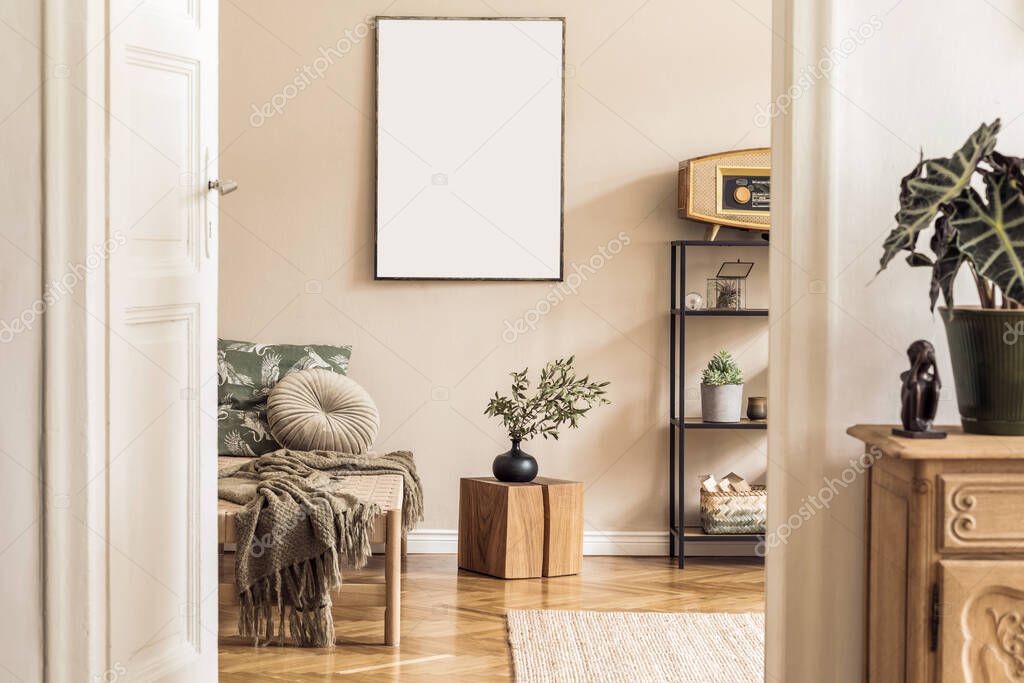 Interior design of korean style living room with modern chaise longue, commode, shelf, wooden cube, retro radio, plants and elegant personal accessories. Mock up paintings on the beige wall. Template