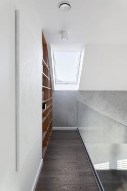 Miniamlistic interior design of creative home library in modern family house. Mock up painting on the wall. real photo. Template