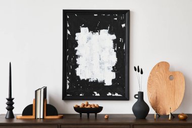 Creative composition of modern living room interior design with mock up poster frame, brown commode, books and personal accessories. White wall. Copy space. Template