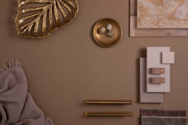 Creative flat lay composition with textile and paint samples, panels and tiles. Stylish interior designer moodboard. Golden and dark beige color palette. Copy space. Template.  clipart