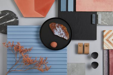Creative flat lay composition of interior designer moodboard with textile and paint samples, blue lamella panels and tiles. Pink, black, blue and light grey color palette. Copy space. Template.  clipart