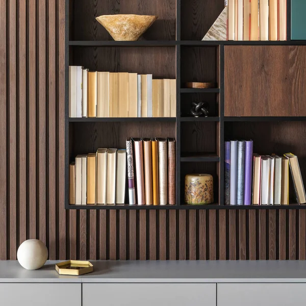 Modern bookcase in lamells wall. Grey chest of drawers. Bookcase a lot of books and accessories. Herringbone wooden parquet. Cat in open spaces.