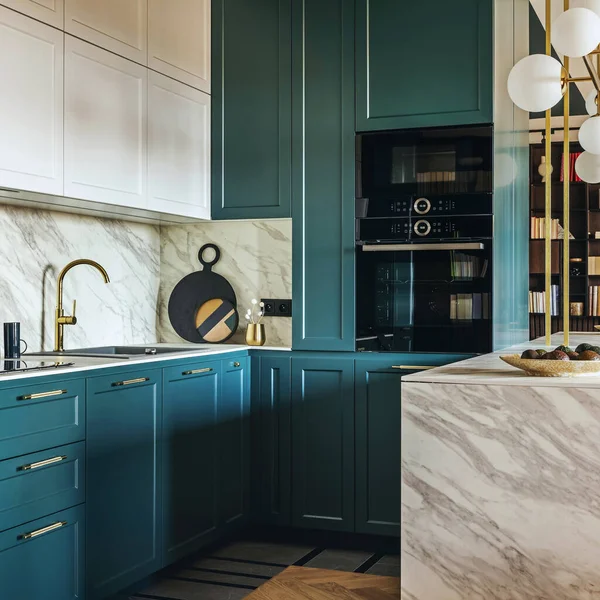 Luxury modern and vintage turquoise and white kitchen. Marble kitchen island with white owal chandelier . Gold tap on marble table top. Template.