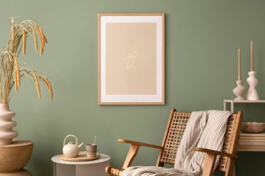 Stylish living room interior design with mock up poster frames, rattan armchair, coffe table, beige carpet and creative home accessories. Sage green wall. Template. 
