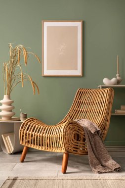 Stylish living room interior design with mock up poster frames, wicker armchair , coffe table, beige carpet and creative home accessories. Sage green wall. Template. 