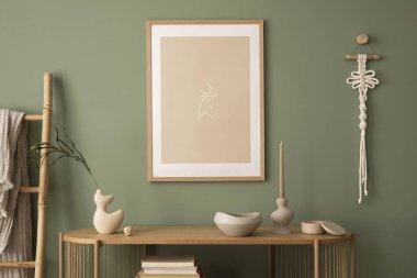 Stylish living room interior design with mock up poster frames, wooden chest of drawers, beige vase and creative home accessories. Sage green wall. Template. 