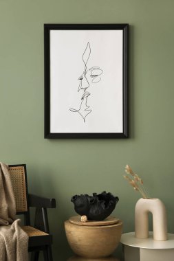 Stylish living room interior design with mock up poster frames, rattan armchair, coffe table, and creative home accessories. Sage green wall. Template. 
