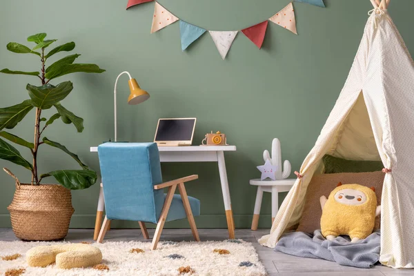 Creative composition of stylish and cozy child room interior design with green wall, plush toys, bright carpet, blue armchair, stool and white accessories. Grey panels floor. Template.
