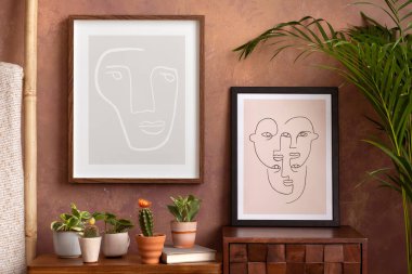 The stylish compostion at living room interior with mock up, design wooden sideboard and elegant personal accessories. Brown wall Cozy apartment. Home decor. Template.