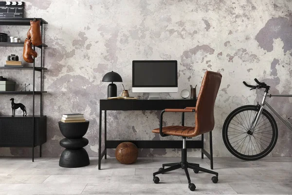Concrete interior of home office with black desk, brown armchair, computer screen, office accessories and lamp. Rack with personal accessories. Home decor. Template.