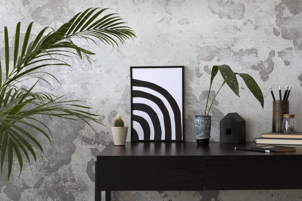 Concrete interior of home office with mock up poster, desk, lamp and office accessories. Grey concrete wall. Home decor. Template.