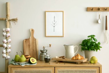 Interior design of kitchen space with rattan commode,  chair, herbs, vegetables, food and kitchen accessories in modern home decor. Mock up poster. Template. 