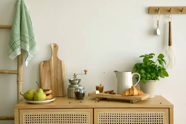 Interior design of kitchen space with rattan commode,  ladder, pears, food and kitchen accessories in modern home decor.  Template.