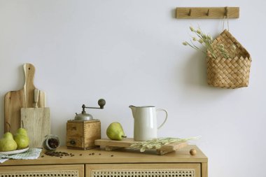 Interior design of kitchen space with rattan commode,  ladder, pears, food and kitchen accessories in modern home decor.  Template.
