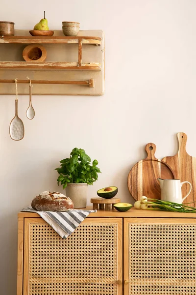 Interior design of kitchen space with rattan commode,  chair, herbs, vegetables, food and kitchen accessories in modern home decor.  Template. 