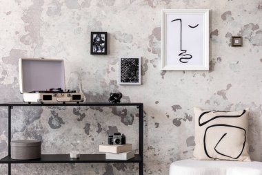 The stylish composition of living room interior with mock up, white pouf with pillow, consola and personal accessories. Mock up poster. Home decor. Template. 