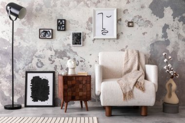 The stylish composition of living room interior with mock up, white armchair, wooden coffee table and personal accessories. Mock up poster. Home decor. Template. 