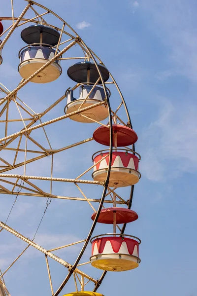 Colorful giant wheel in park amusement with blue sky on background