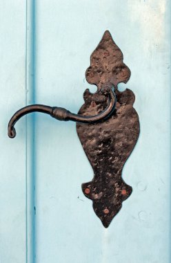 Antique brass knob on blue door on colonial city of Santana do Parnaiba, Sao Paulo state, Brazil
