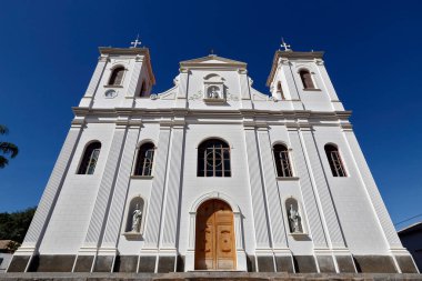 White catholic church under intense blue cloudless sky. Sao Luiz do Paraitinga city, Sao Paulo state, Brazil