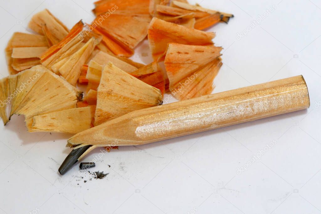 Stump of natural wood pencil with broken tip, on white background