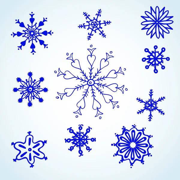 Set flocons de neige bleu doodle . — Image vectorielle