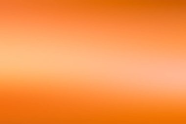 Ortasında ışık çizgisi olan turuncu bulanık duvar kağıdı.