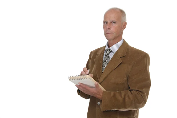 Mature man taking notes — Stock Photo, Image