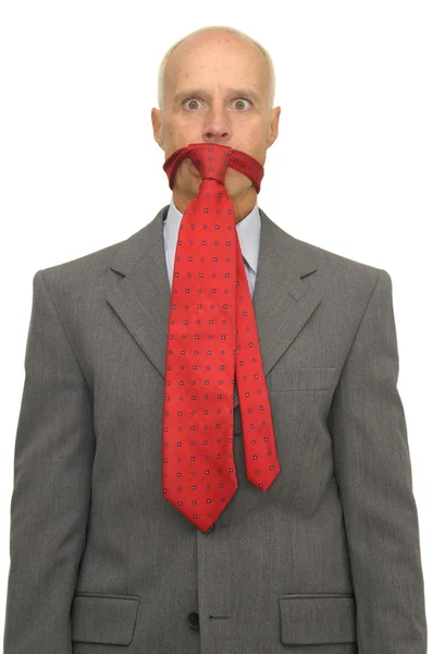 Бизнесмен с галстуком во рту — стоковое фото