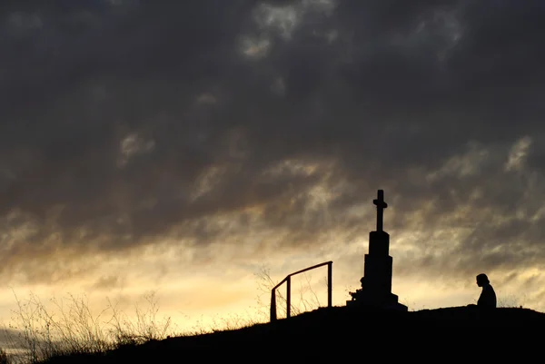 Cross and a person — Stock Photo, Image