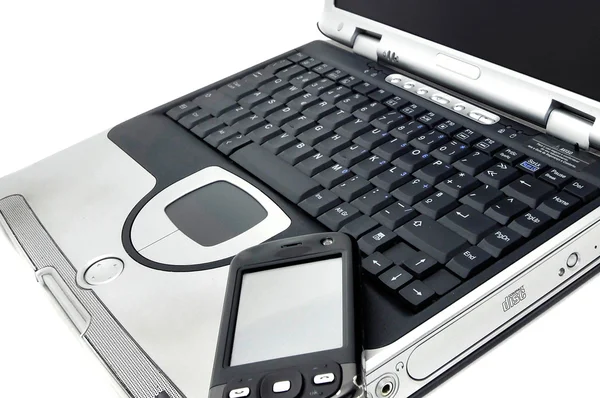 Laptop com celular — Fotografia de Stock
