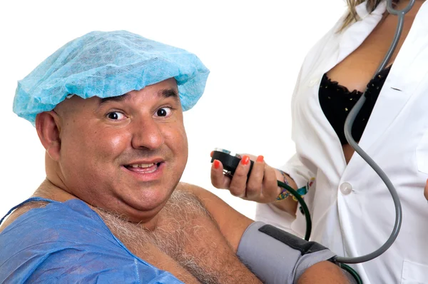 Large happy male patient with sexy doctor — Stock Photo, Image