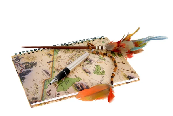 Travel diary with a pen and feathers — Stock Photo, Image