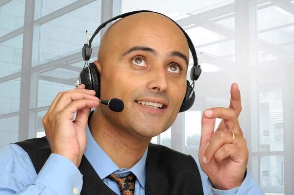 Businessman with headset — Stock Photo, Image