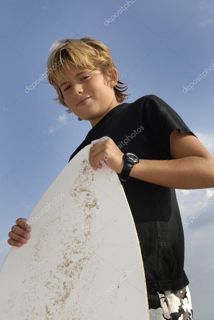 Boy with skim-board Stock Photo by ©luislouro 23589985