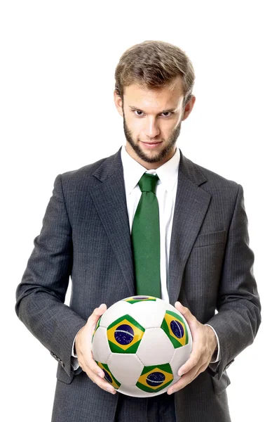 Empresário com bola de futebol da bandeira brasileira — Fotografia de Stock