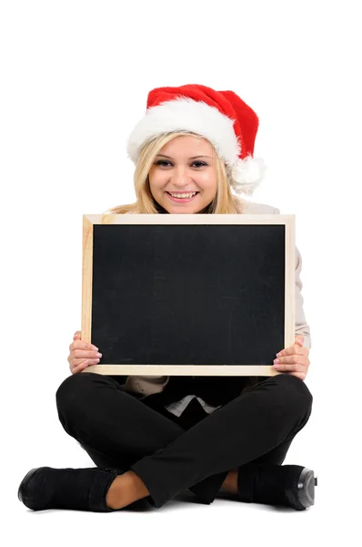 Woman in Christmas hat with board — Stock Photo, Image