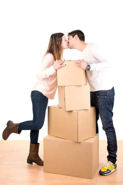 Happy couple with boxes — Stock Photo, Image