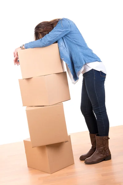 Tired girl with boxes — Stock Photo, Image