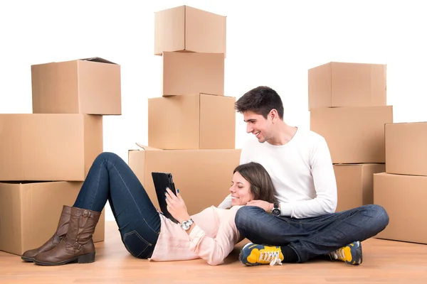 Happy couple with boxes — Stock Photo, Image