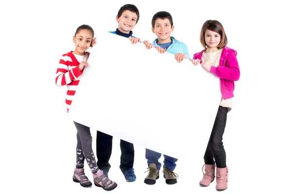 Crianças com uma prancha branca — Fotografia de Stock
