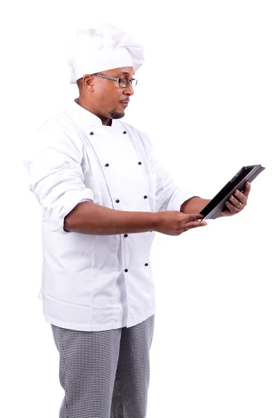 Chef avec tablette cheking une recette — Photo