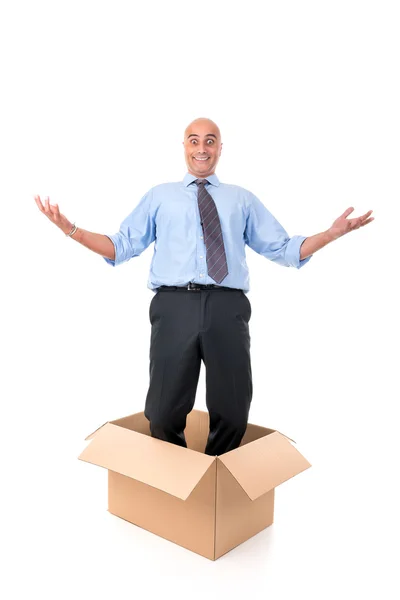 Бизнесмен в коробке — стоковое фото