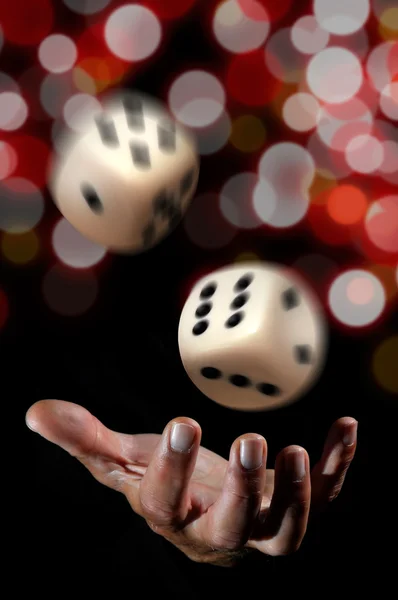 Hand throwing dice — Stock Photo, Image