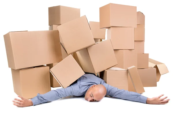 Businessman under boxes — Stock Photo, Image
