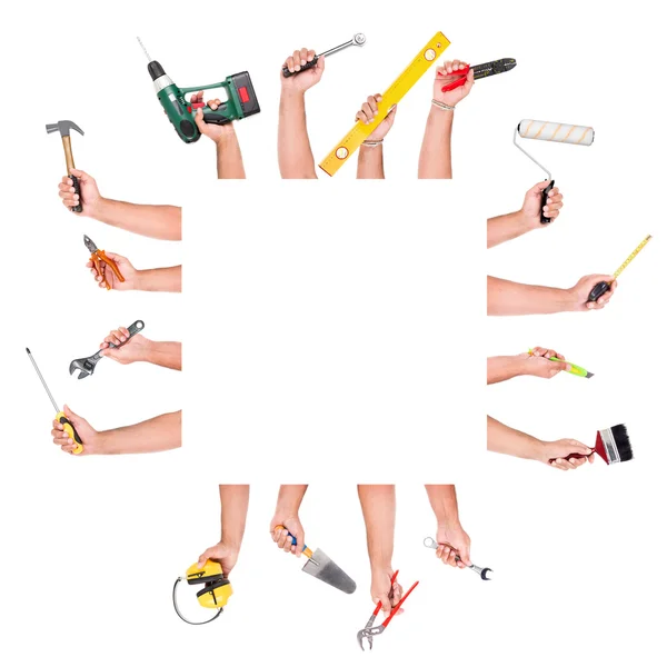 Mãos com ferramentas de construção — Fotografia de Stock